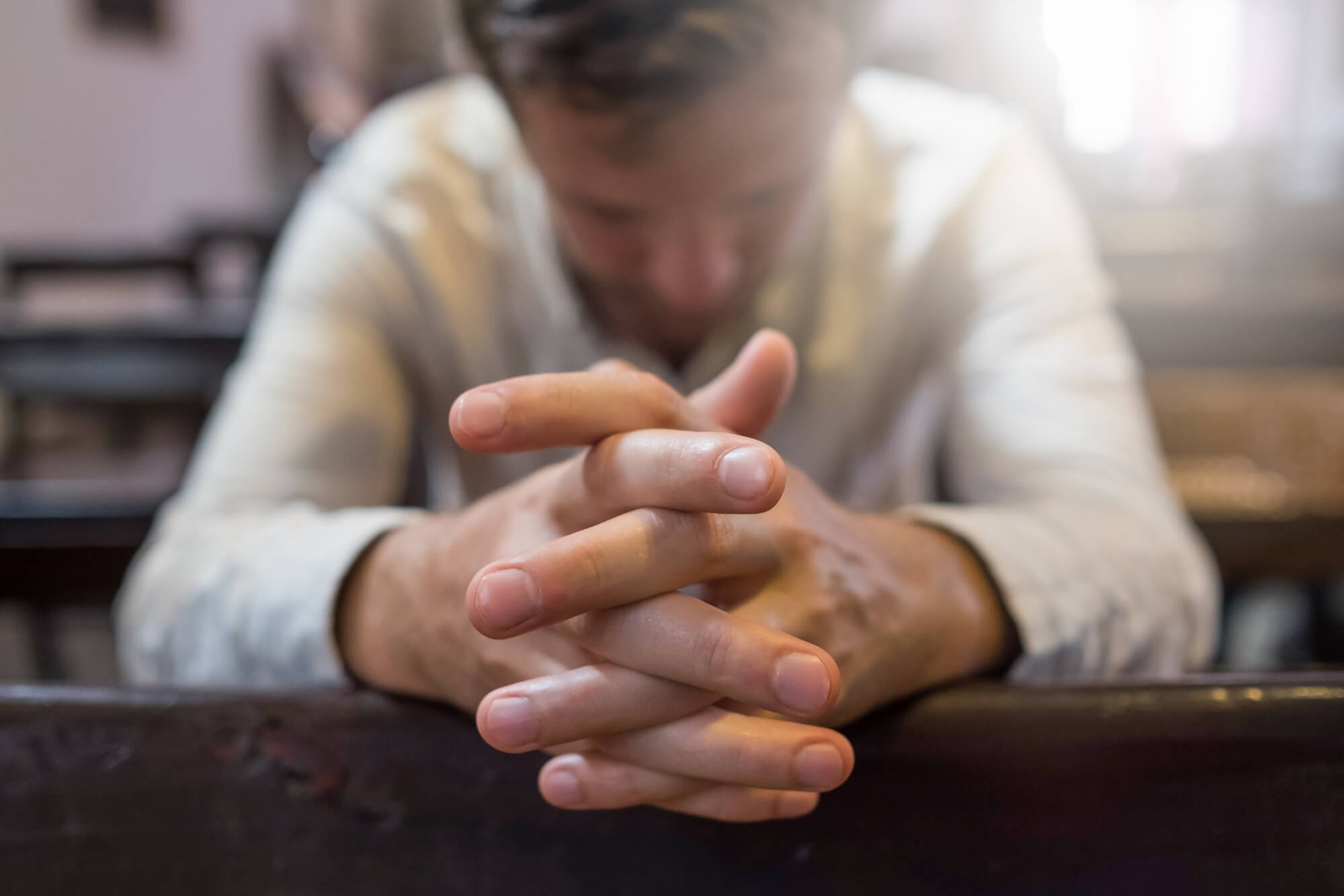 Man praying in church